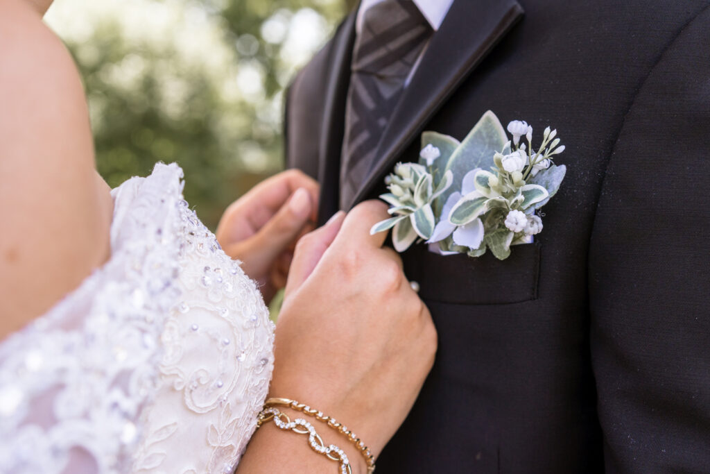 bride holding the lapel of her groom Chicago Wedding Venues