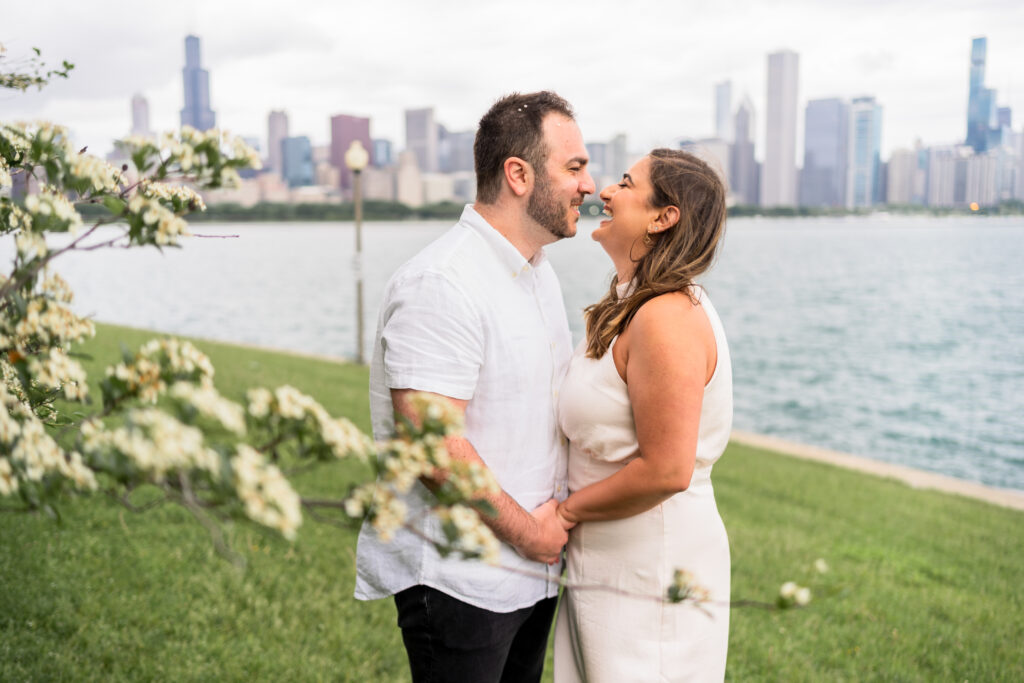 bride and groom near the water with the chicago skyline during their Chicago elopement