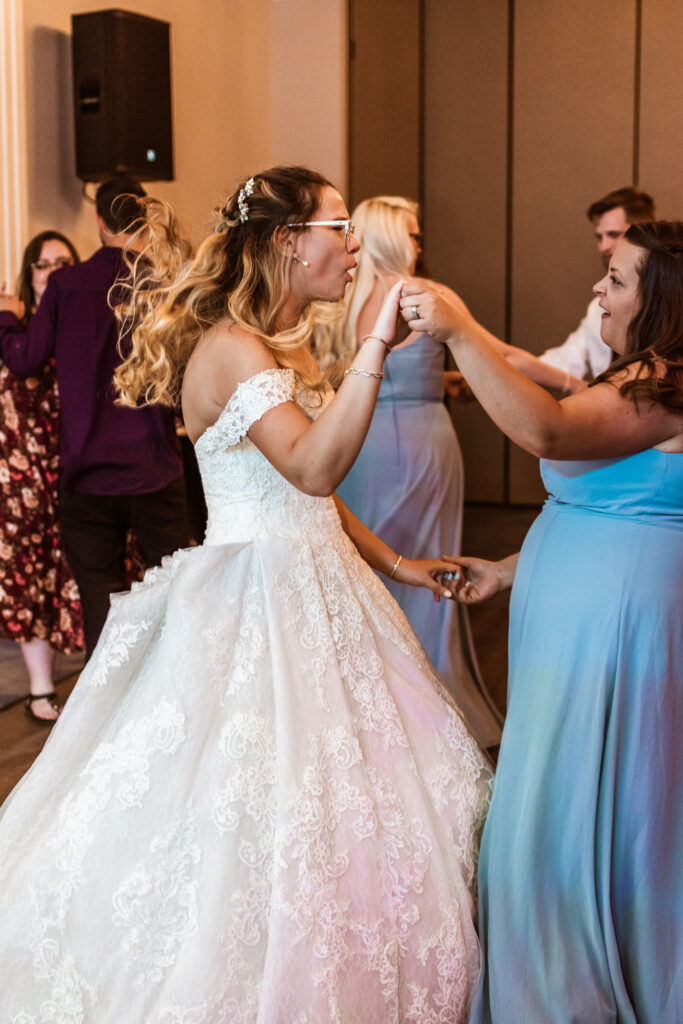Bride dancing with her bridesmaids at her Wedding Reception Venues in Chicago