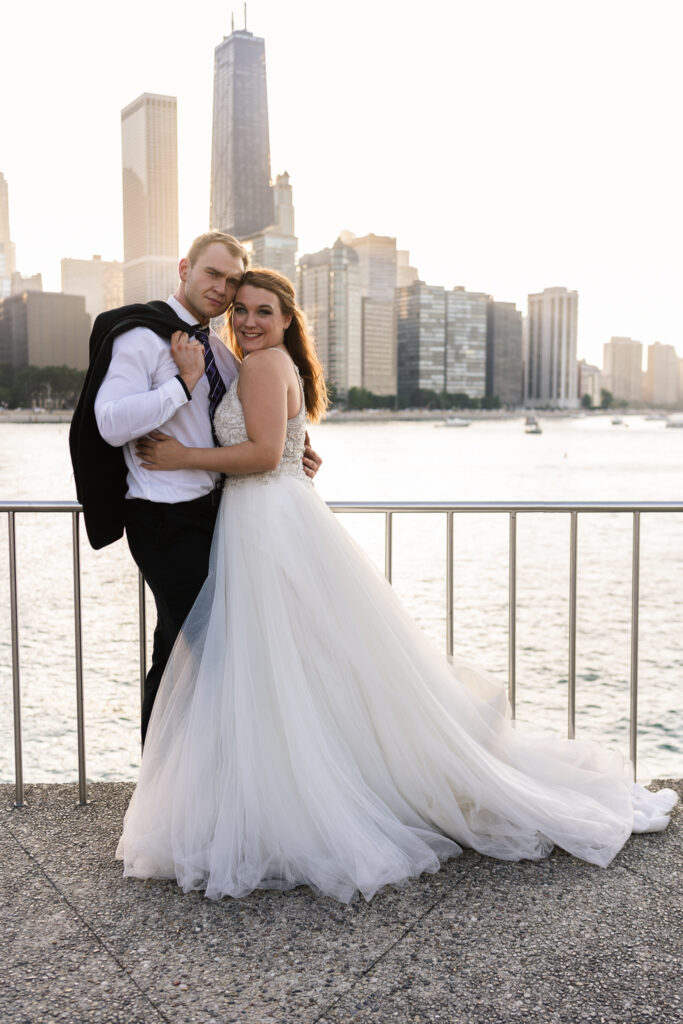 bride and groom hugging near the city skyline Wedding Venues in Evanston