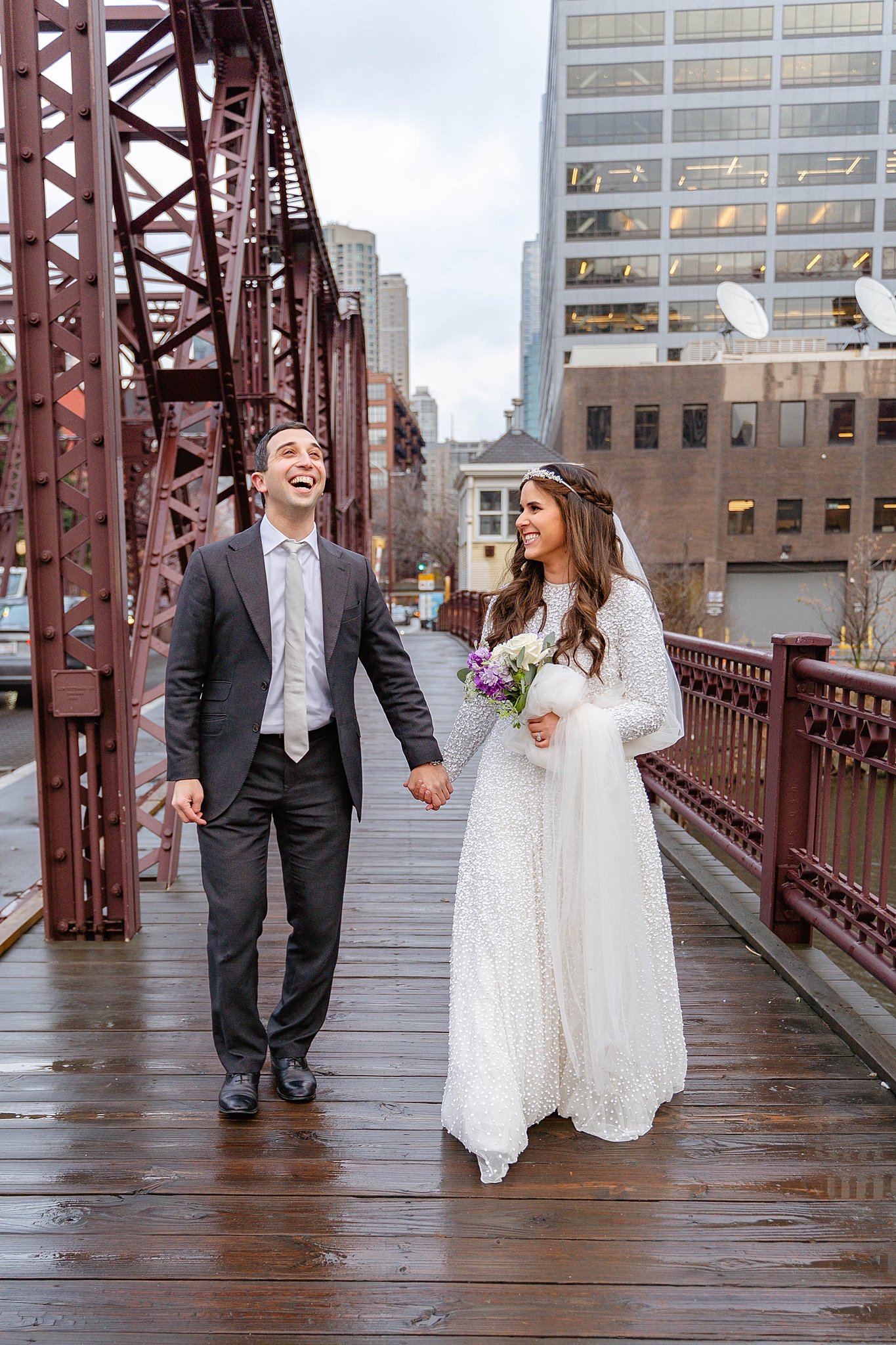 bride and groom walking down the bridge in downtown chicago with Jewish Wedding Traditions