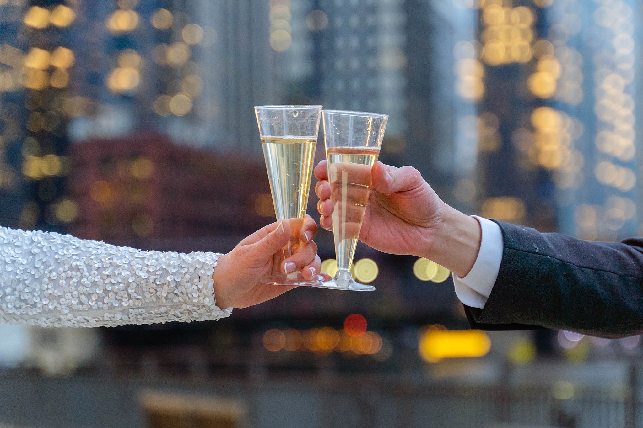 bride and groom sharing a champagne toast