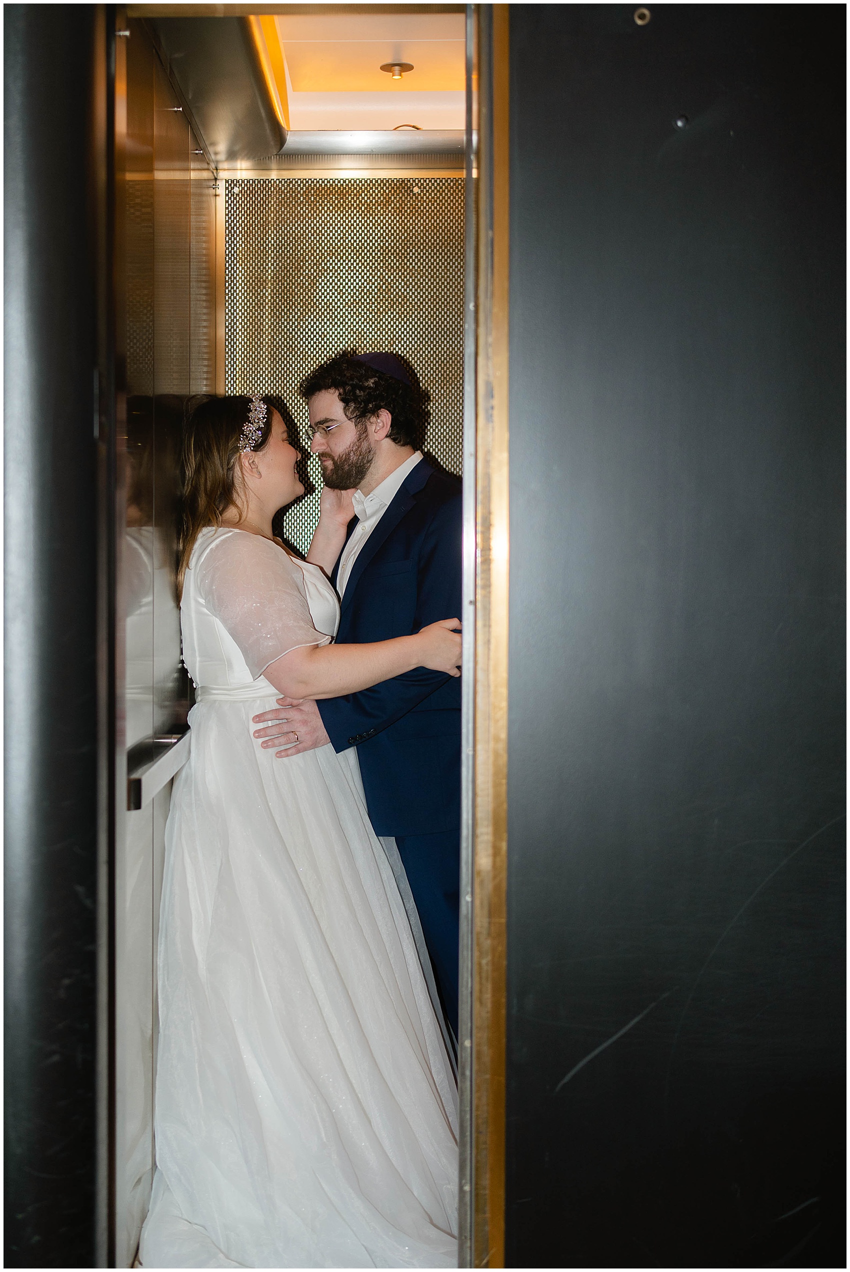 bride and groom sneaking a moment in an elevator at their Kimpton Gray Wedding
