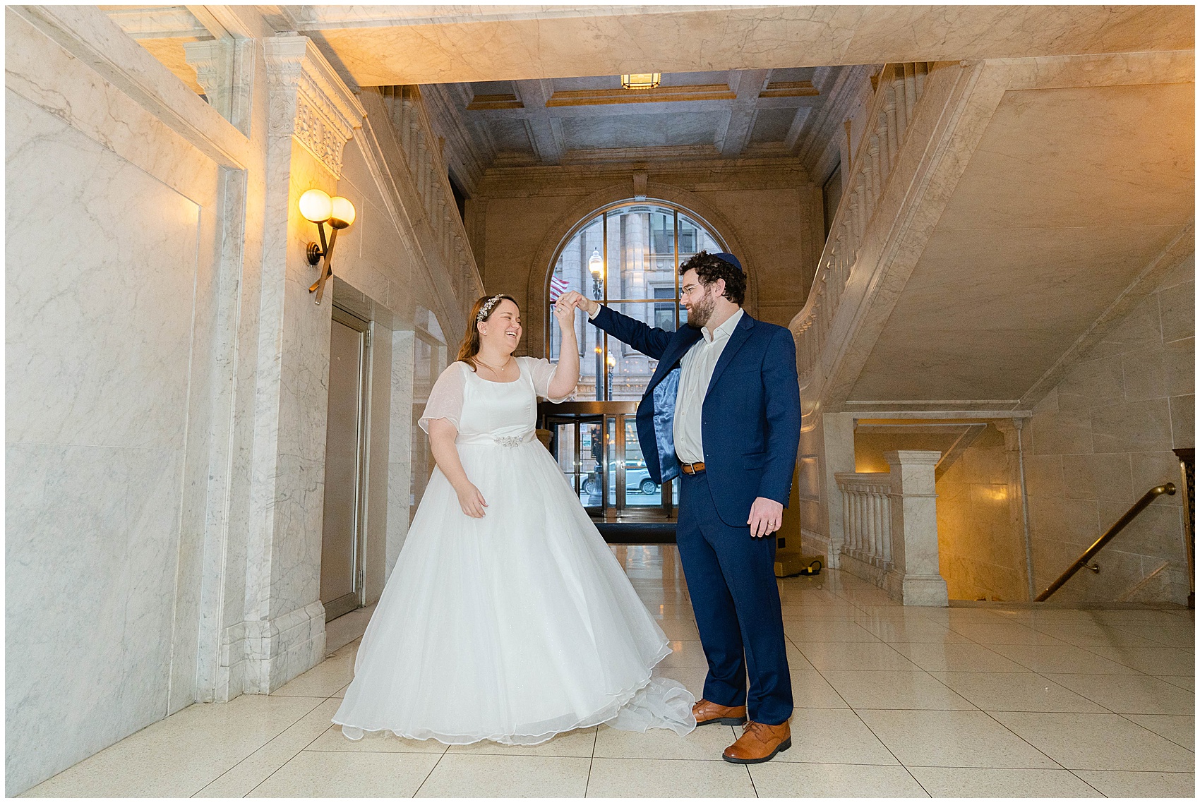bride and groom dancing in the lobby at their Kimpton Gray Wedding