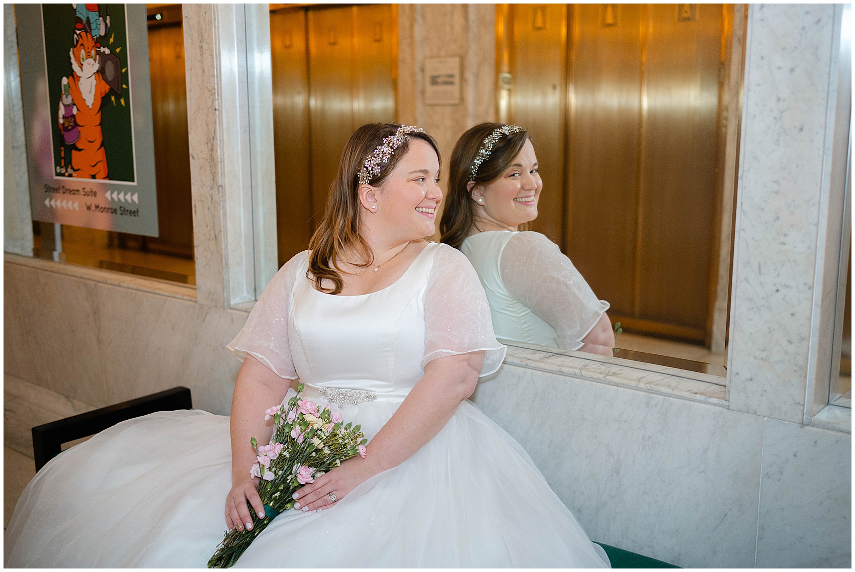 bride sitting and looking in the mirror at her Kimpton Gray Wedding