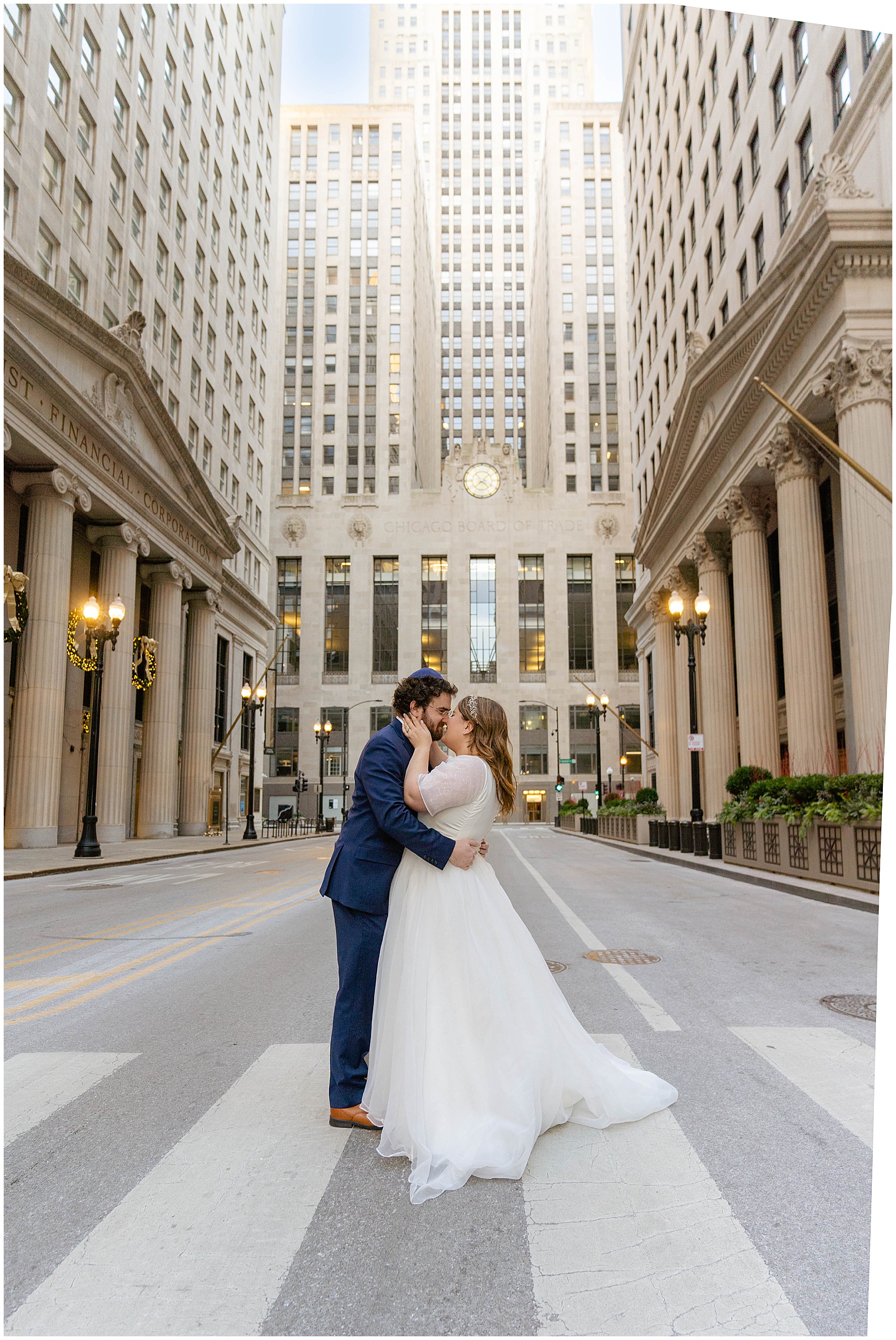 bride and groom sharing a kiss in the street in Chicago at their Kimpton Gray Wedding