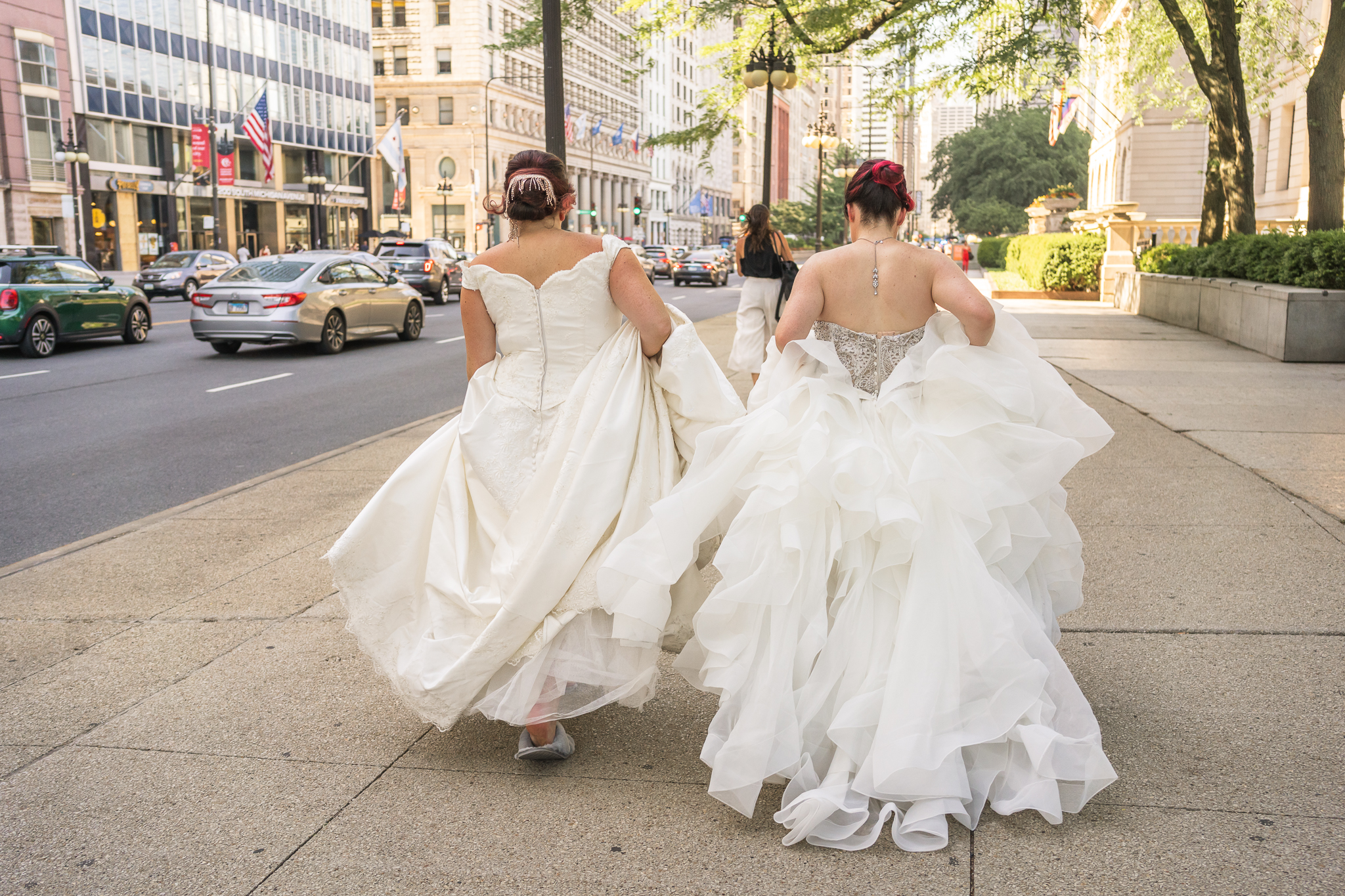 brides walking down the sidewalk in downtown chicago