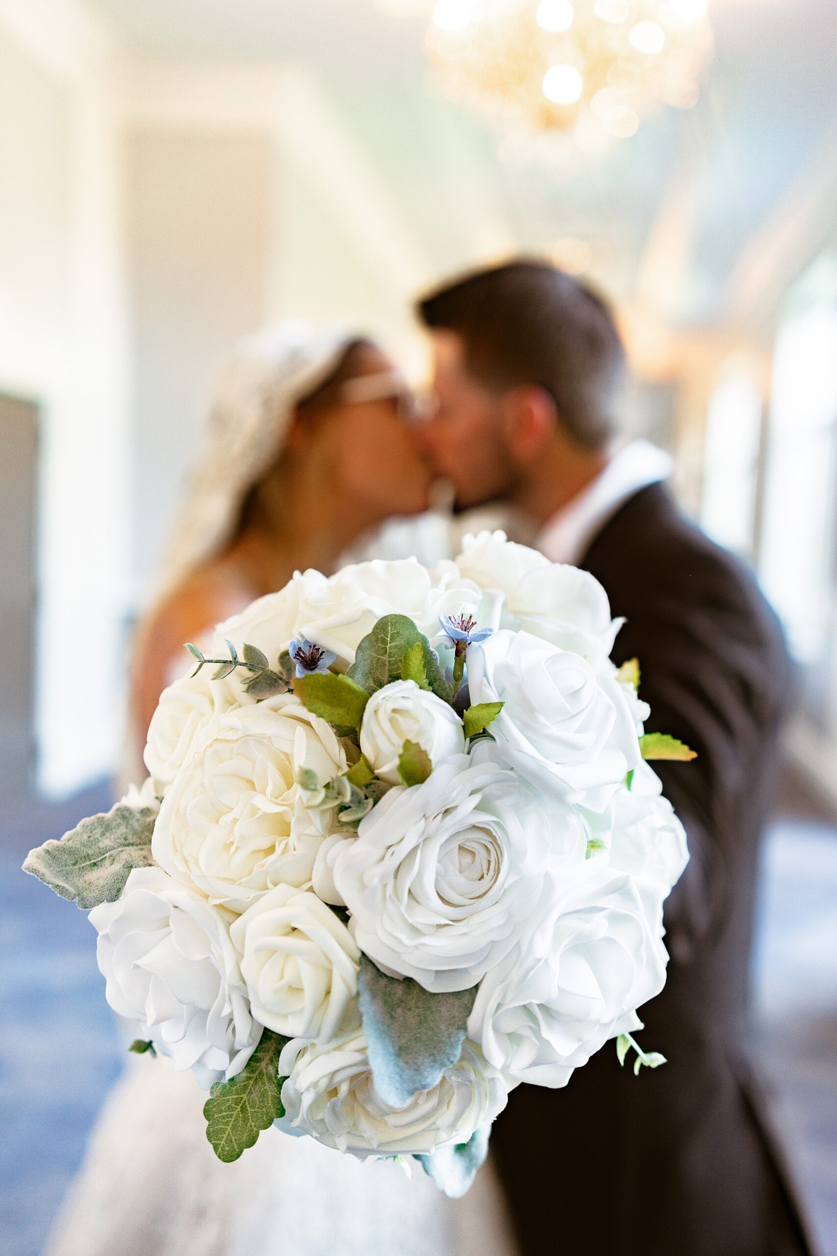 bride and groom sharing a kiss while holding out the bouquet chicago hotel wedding venues