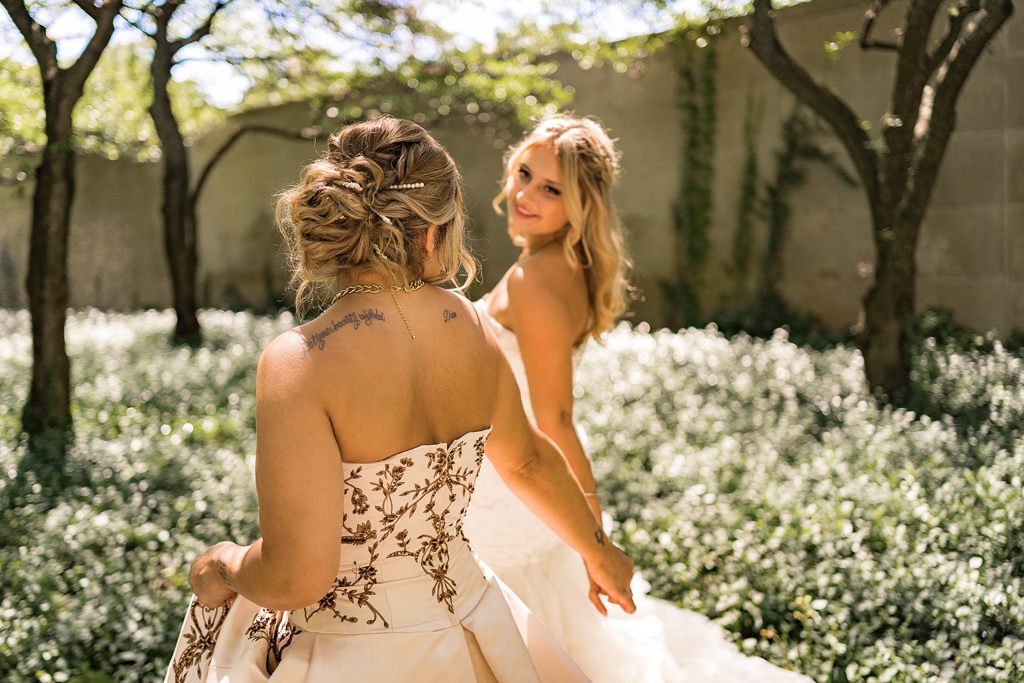 brides standing in the garden of crystal gardens wedding venue