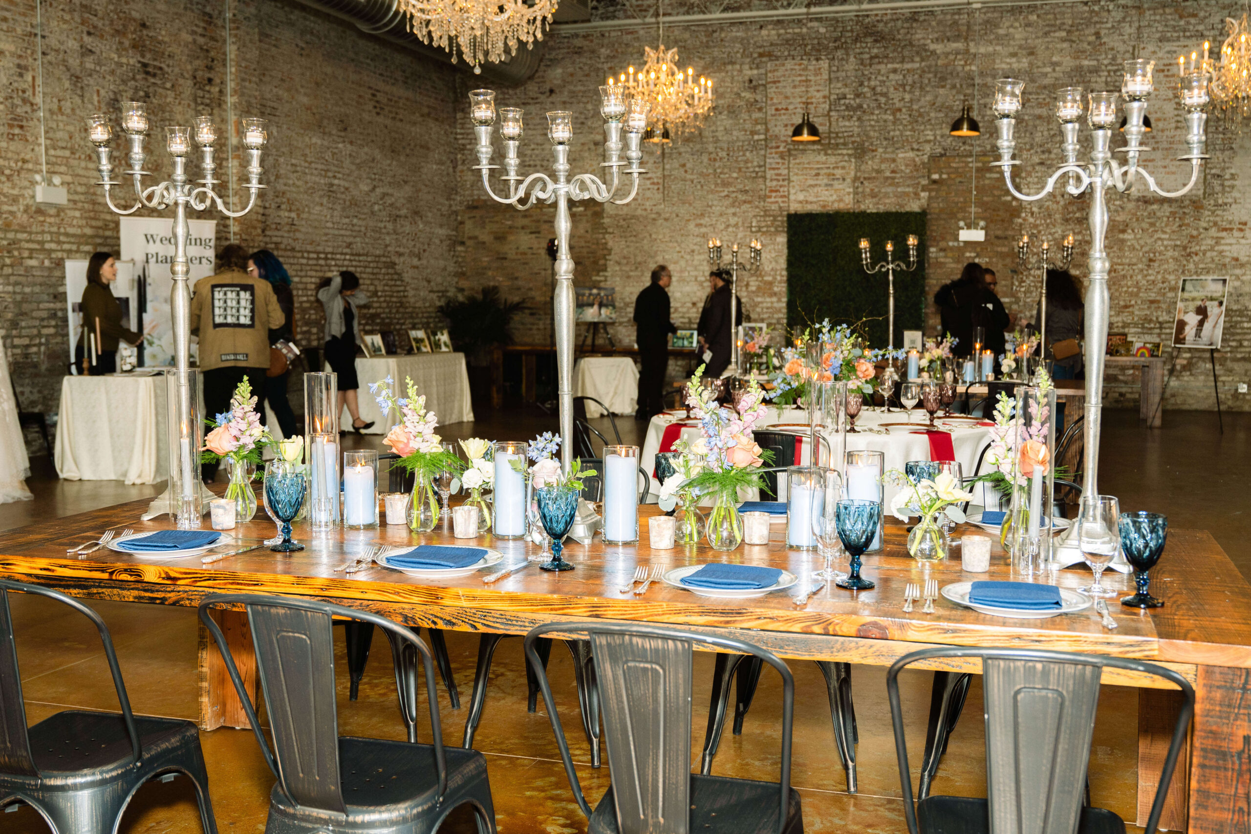 A table is set with gorgeous tablewhere and candelabras at The Carter Chicago