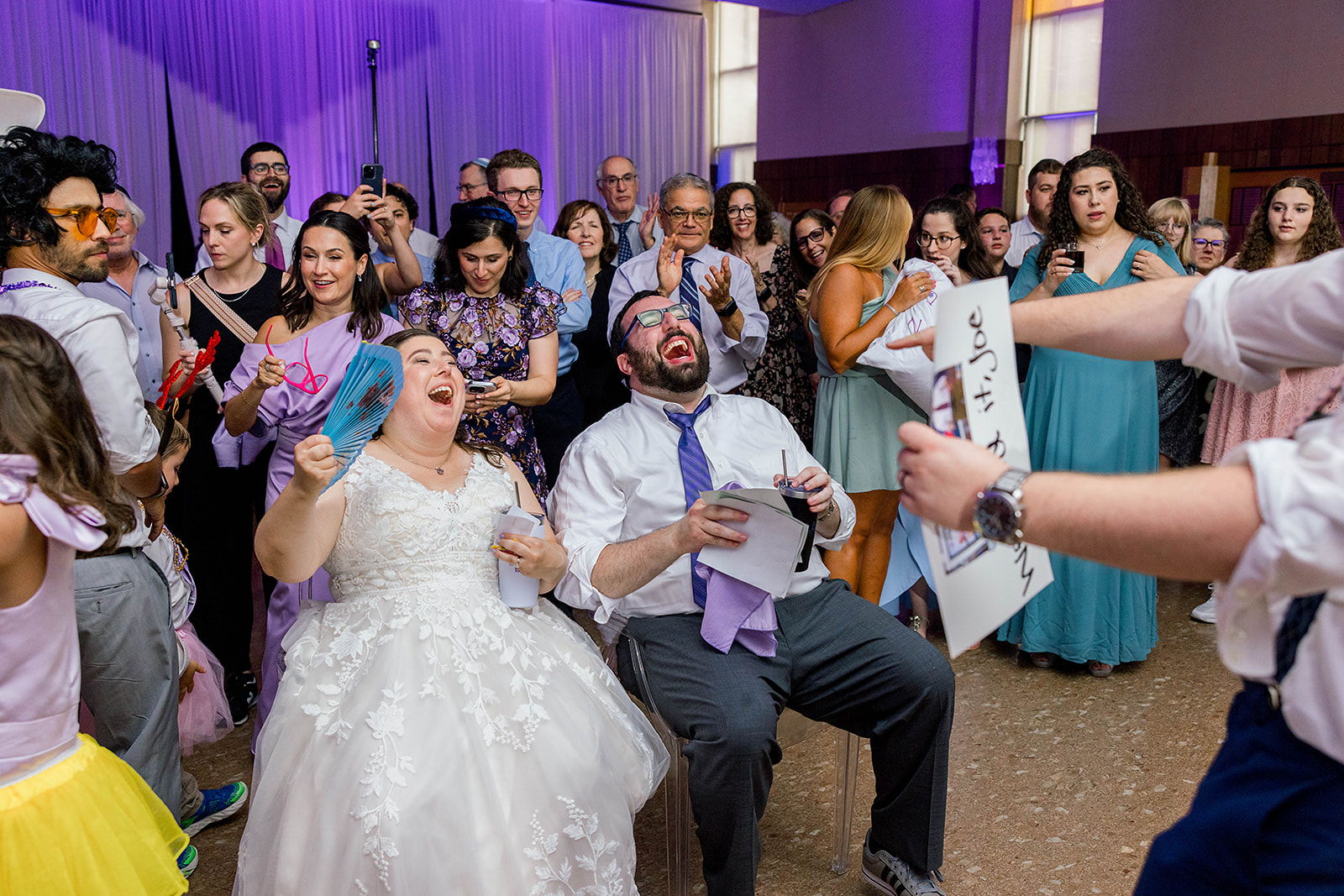 A jewish couple laughs during their wedding shtick.