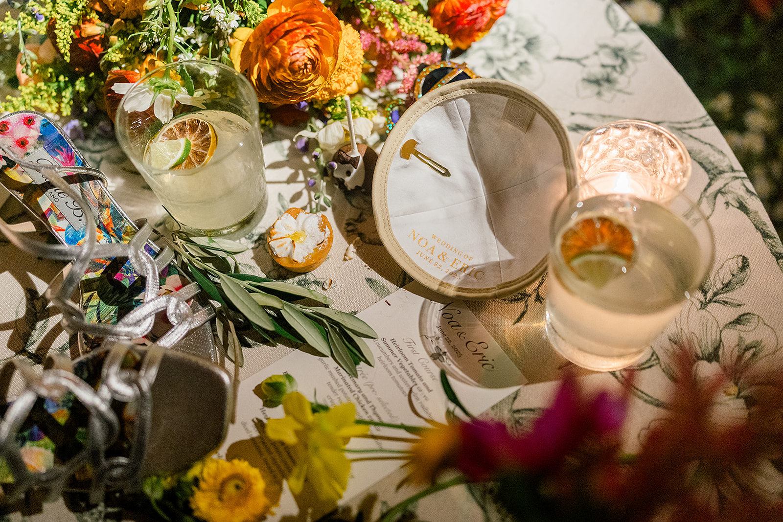Details of a custom yamaka and drinks on a table with vibrant florals